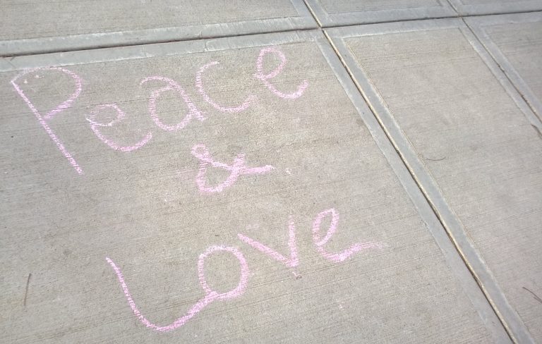 Peace and Love written on the ground