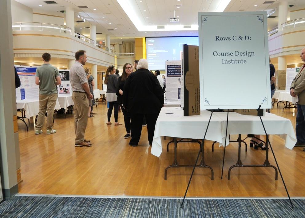 People looking at posters at the Celebration of Teaching