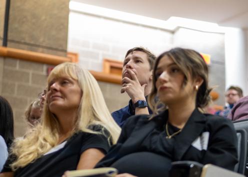 KU faculty members sitting listening to keynote speaker