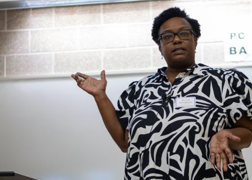Keynote speaker Beronda Montgomery speaking at the front of a lecture hall at KU.