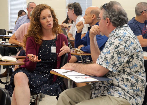 KU faculty discussing a topic during Teaching Summit workshop.