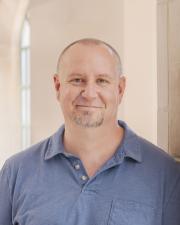 Photo of a man looking at the camera